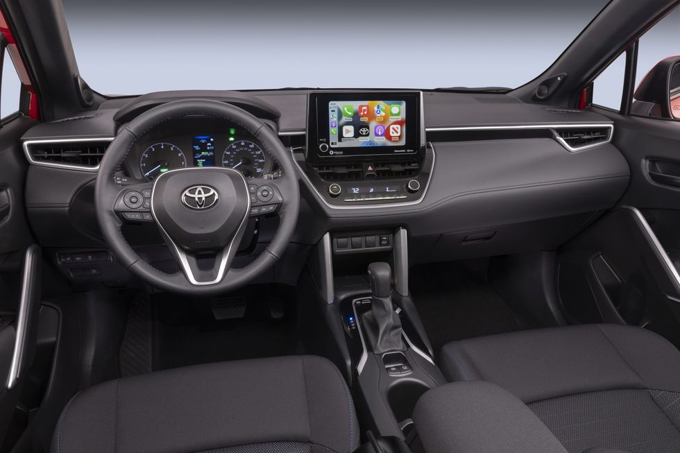 2023-toyota-corolla-cross-se-hybrid-interior-photo-dashboard-and-steering