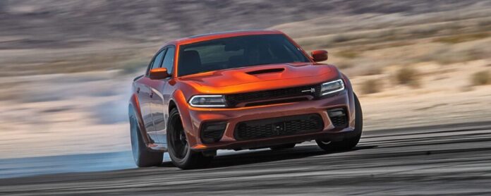 2022-dodge-charger-r_t-scat-pack-in-orage-drifting-on-track