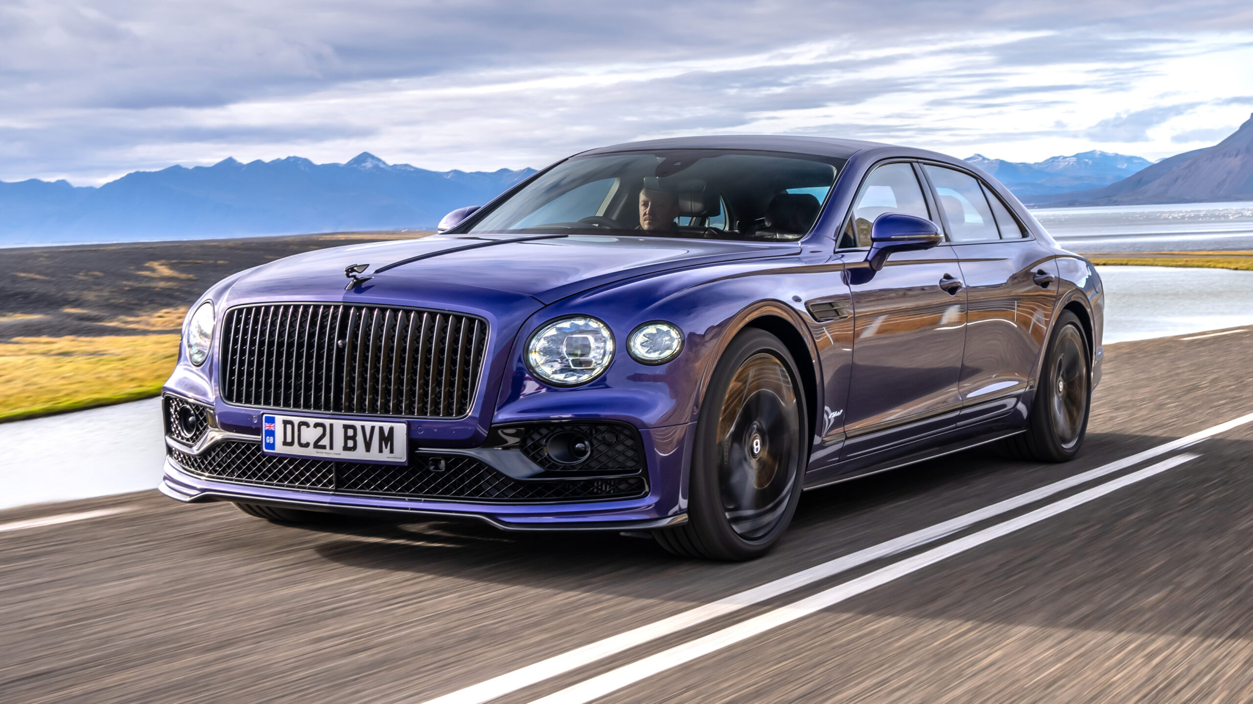 2022-bentley-flying-spur-hybrid-front-three-quarters-moving